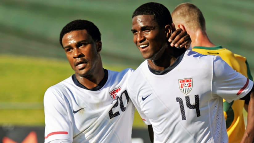 Robbie Findley congratulates Edson Buddle in US' 3-1 win over Australia.