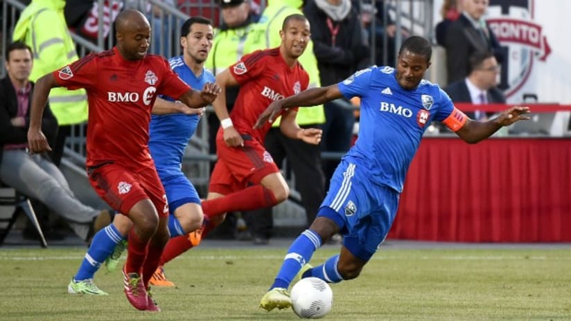 Collen Warner (Toronto FC) pursues Patrice Bernier (Montreal Impact) during the 2015 Canadian Championship