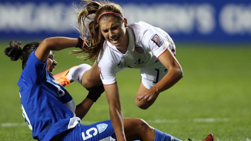 Alex Morgan is tripped by a Guatemala player in CONCACAF play