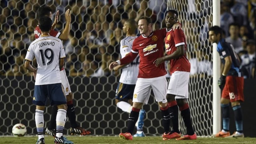 Danny Welbeck and Wayne Rooney celebrate a goal for Manchester United vs. LA Galaxy