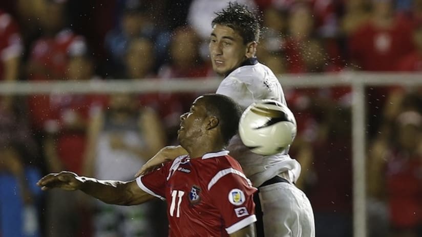 Alejandro Bedoya and a Panamanian player contest a ball
