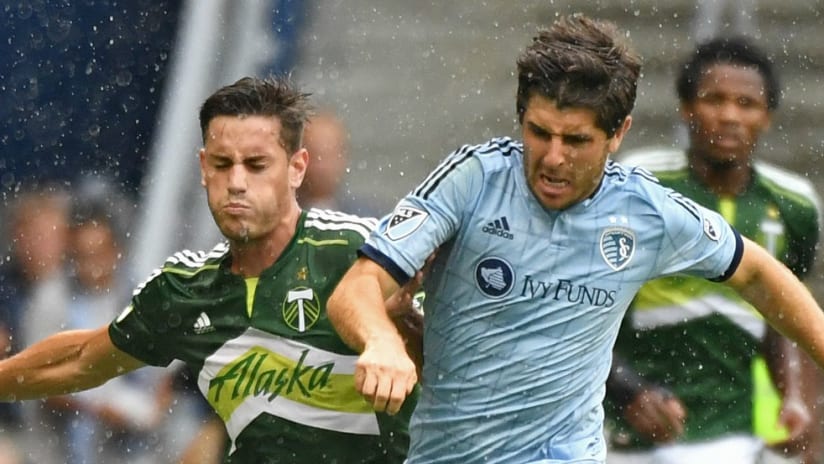 Lucas Melano, Connor Hallisey - Portland Timbers, Sporting Kansas City - battle in the rain for a ball