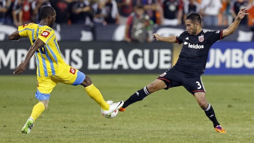 D.C. United's David Estrada contests a ball with a Waterhouse FC player