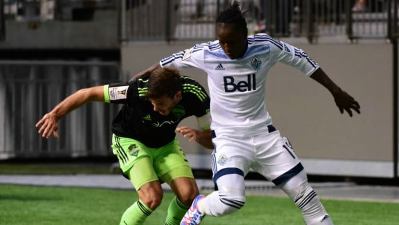Brad Evans (Seattle Sounders) and Darren Mattocks (Vancouver Whitecaps) in the 2015-16 CCL