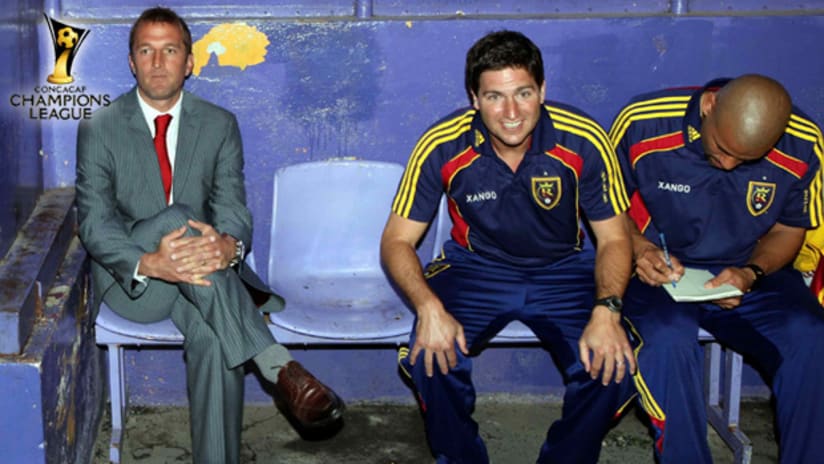 Real Salt Lake head coach Jason Kreis (left) sits with his coaching staff before the CONCACAF semifinal matchup against Saprissa on Tuesday night.