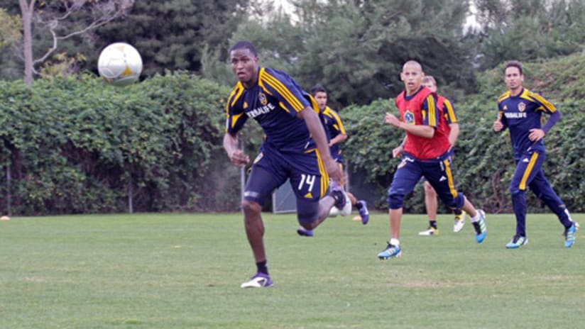 Edson Buddle chases down a loose ball in his first training session back with LA.