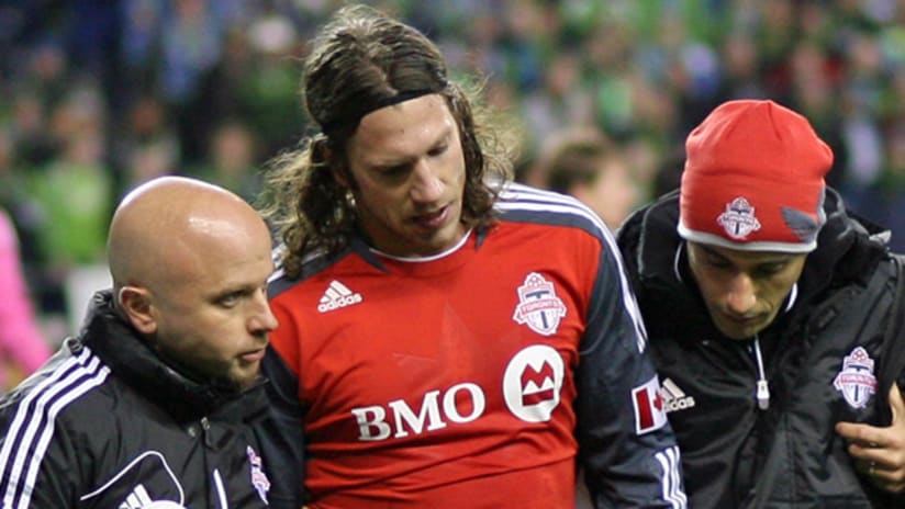 Toronto FC's Torsten Frings winces in pain after suffering a hamstring injury on Saturday.