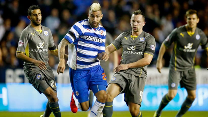 Danny Williams breaks away from two defenders with Reading