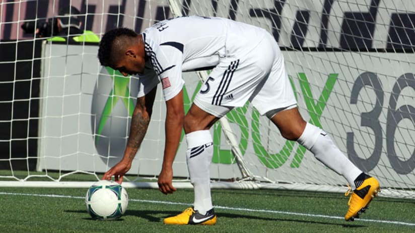 Defender Sean Franklin picks the ball out of the Galaxy net