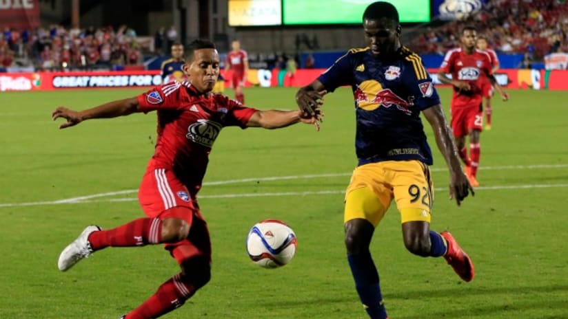 Michael Barrios (FC Dallas) tries to shoot against Kemar Lawrence (New York Red Bulls)
