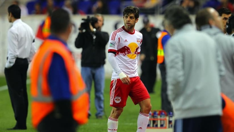 Juninho leaves the field after getting a red card