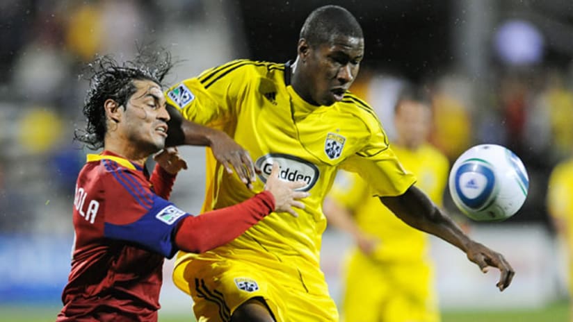 Real Salt Lake's Alex Nimo takes an elbow from the Crew's Andy Iro on Saturday night at Crew Stadium.