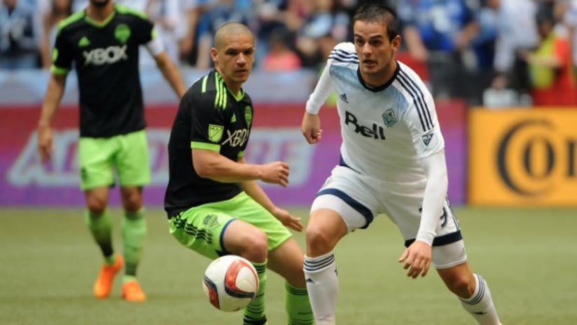 Ozzie Alonso (Seattle Sounders) and Octavio Rivero (Vancouver Whitecaps) in action