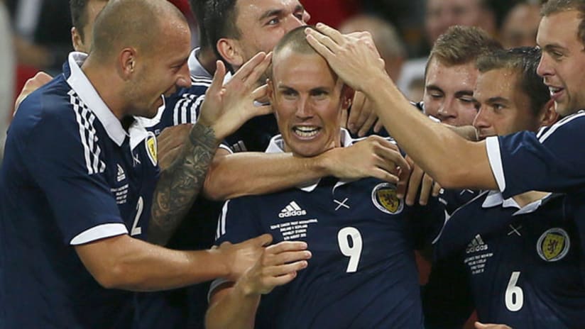 Kenny Miller celebrates his goal with the Scotland national team