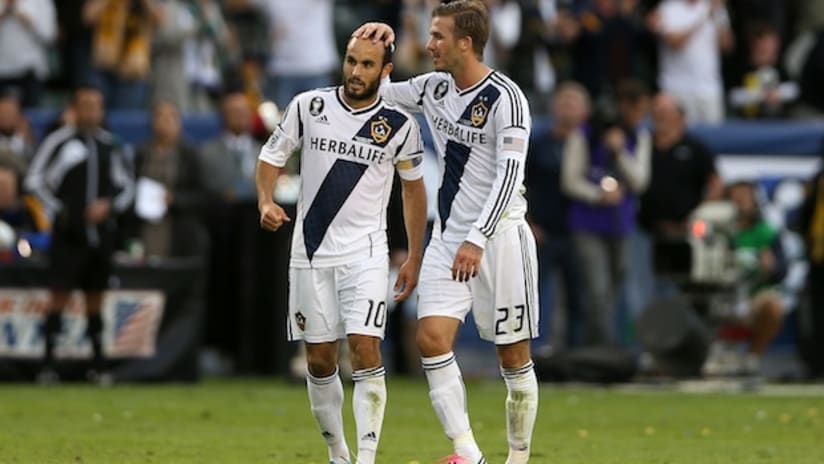 David Beckham rubs Landon Donovan's bald spot for good luck