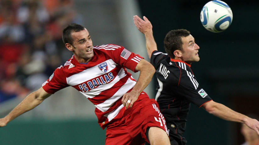 Stephen King of D.C. United is fouled by Andrew Jacobson of FC Dallas at RFK Stadium on May 7, 2011.