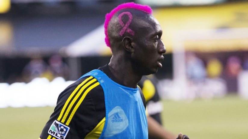 Dominic Oduro with pink hair for Breast Cancer Awareness month, 2013