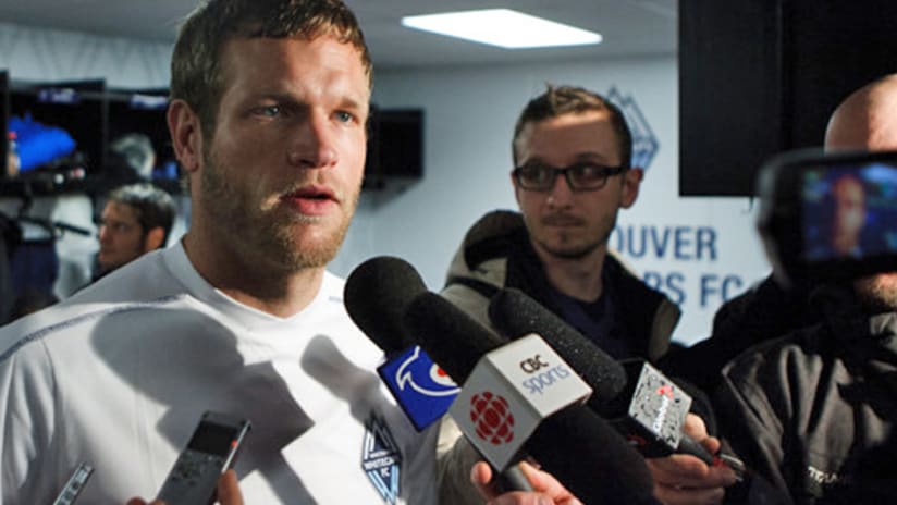 The Whitecaps' Jay DeMerit talks to media in Vancouver
