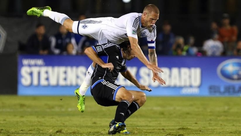 Jay DeMerit goes over Alan Gordon in his return to the field