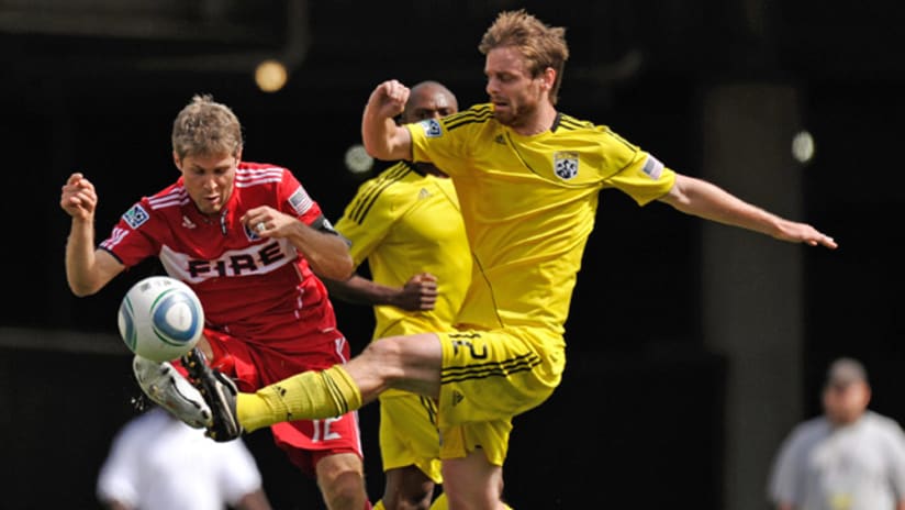 The Columbus Crew's Eddie Gaven fires a shot past Chicago's Logan Pause on Sunday.