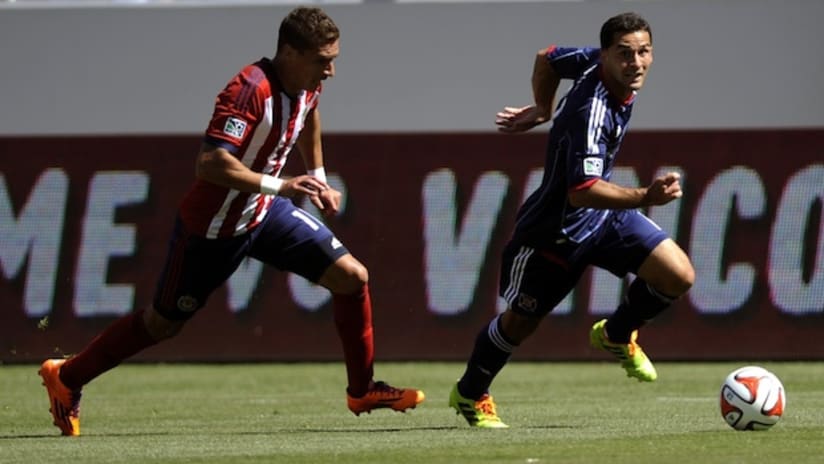 Chivas USA's Leandro Barrera chases down Chicago's Dilly Duka