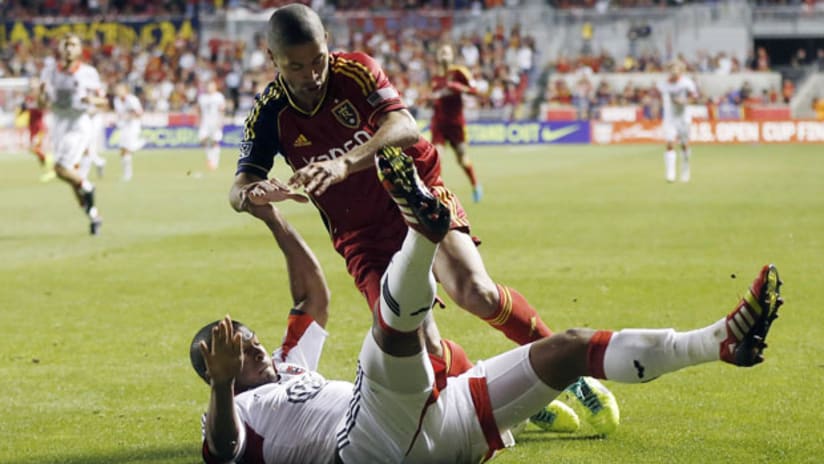 RSL's Alvaro Saborio is tackled by DC's Ethan White