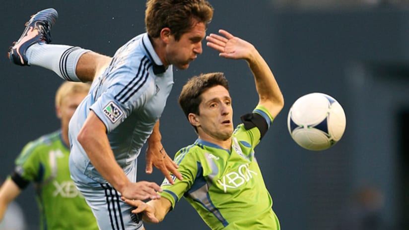 Sporting's Michael Thomas challenges Seattle's Alvaro Fernandez.