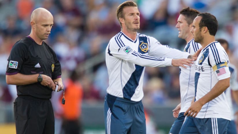 Members of the LA Galaxy argue with a referee