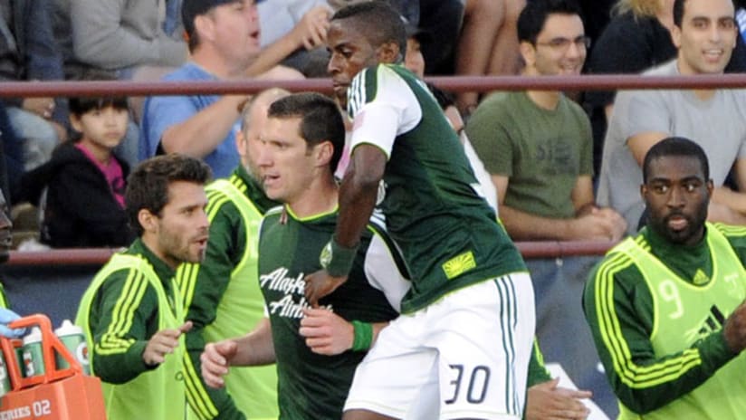 Kenny Cooper celebrates his goal with Portland teammate Lovel Palmer