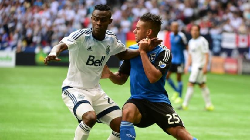 San Jose Earthquakes' Quincy Amarikwa battles with Vancouver Whitecaps' Gerson Koffie