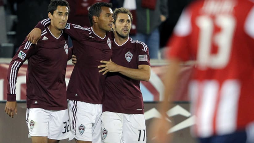 Rapids' Tony Cascio (left), Kamani Hill (center) and Brian Mullan celebrate Hill's goal vs. Chivas USA