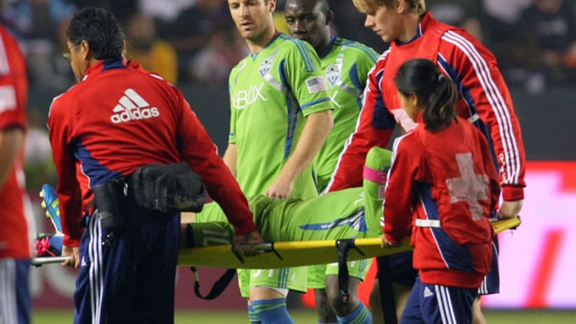 Seattle's Mauro Rosales is stretchered off the field against Chivas USA