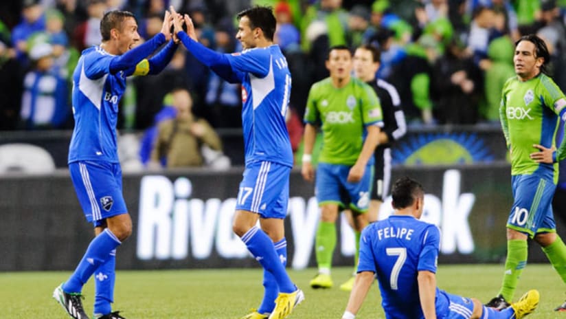 Davy Arnaud and Dennis Iapachino celebrate Montreal Impact's victory over the Seattle Sounders.