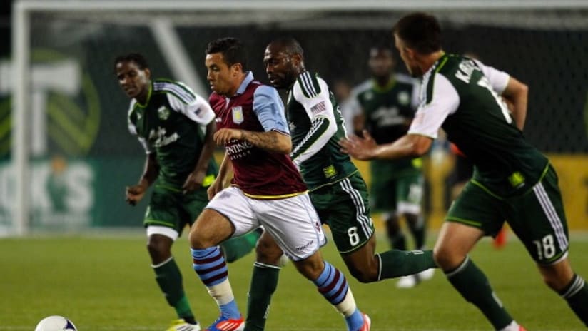 Samir Carruthers of Aston Villa holds of Portland Timbers