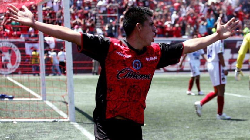 Joe Corona scored the first goal as Tijuana beat Irapuato 2-1 to earn promotion to Mexico's top flight.