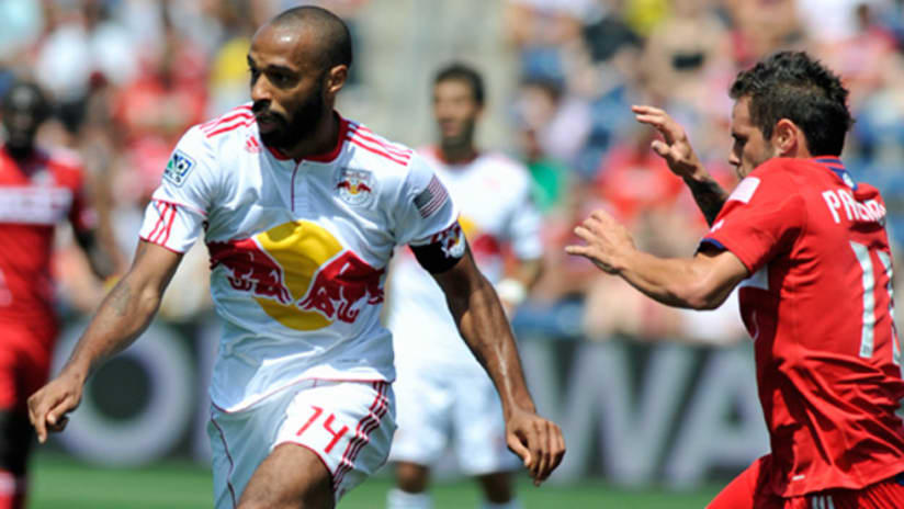 New York's Thierry Henry (left) moves past Chicago's Marco Pappa during the teams' 1-1 draw on Sunday.