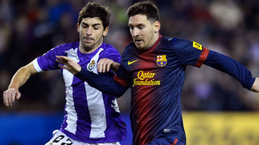 Victor Perez (reported Fire signing) defends against Lionel Messi in a La Liga game