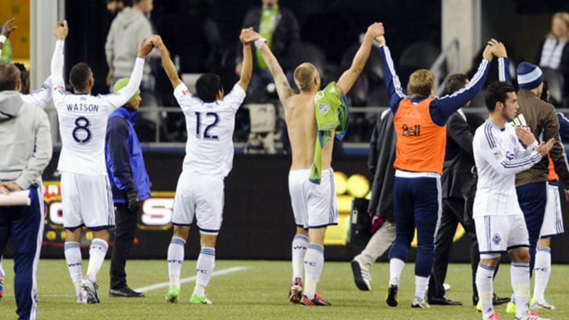 Vancouver Whitecaps salute their fans after their win in Seattle