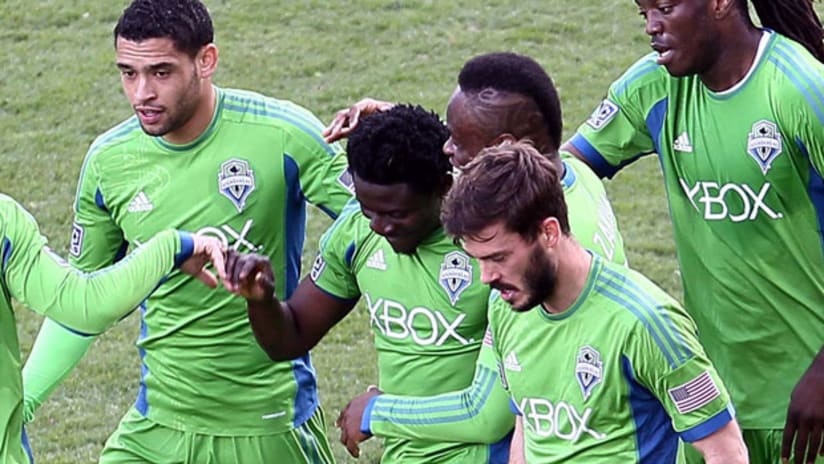 Obafemi Martins celebrates his first MLS goal with Steve Zakuani