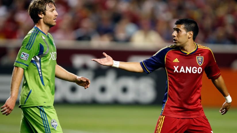 Seattle's Jeff Parke and RSL's Javier Morales exchange some words