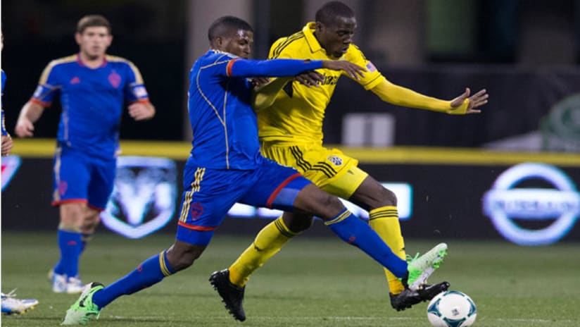 Edson Buddle challenges Tony Tchani in CLBvCOL