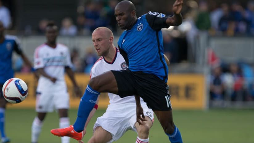 San Jose Earthquakes forward Innocent shields the ball from from Chicago Fire's Eric Gehrig