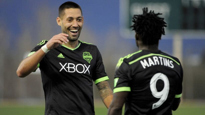 Clint Dempsey and Obafemi Martins celebrate a goal for the Seattle Sounders