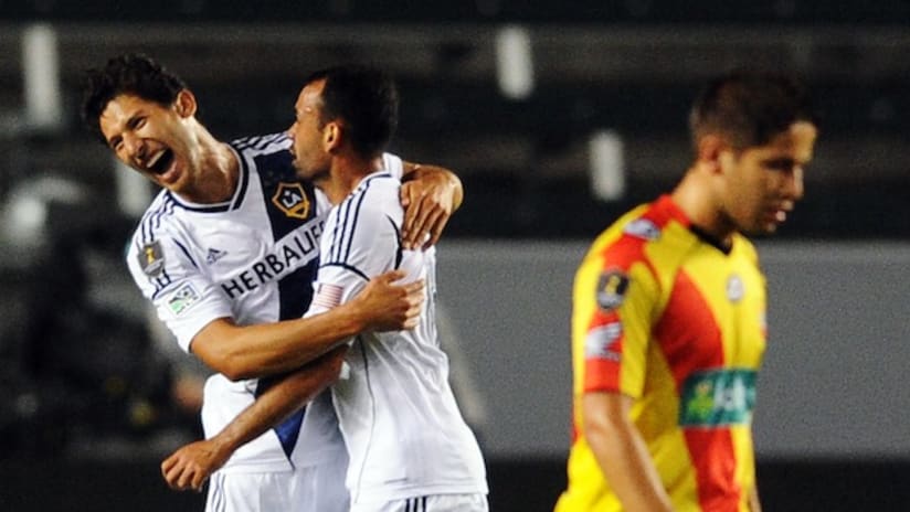 Omar Gonzalez and Juninho celebrate a goal vs. Herediano