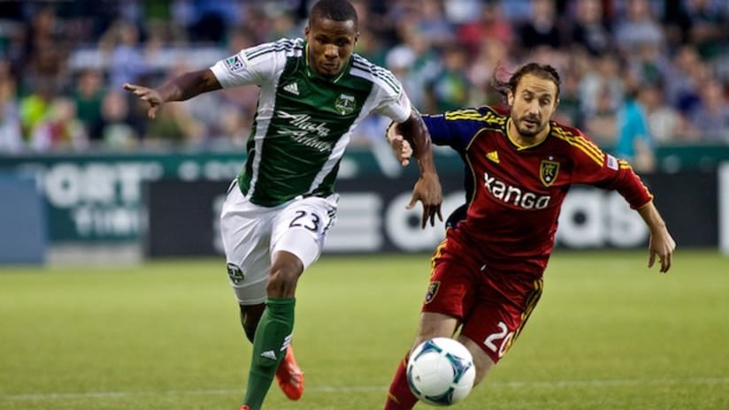 Ned Grabavoy and Alvas Powell battle for the ball
