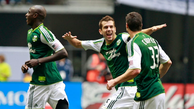 The Timbers celebrate Kenny Cooper's goal against Vancouver