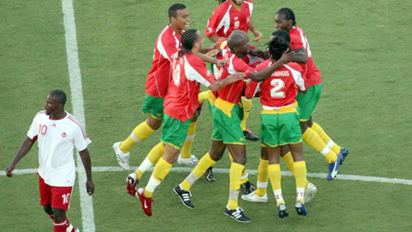 Ali Gerba watches as Guadeloupe celebrate their upset of Canada in 2007.