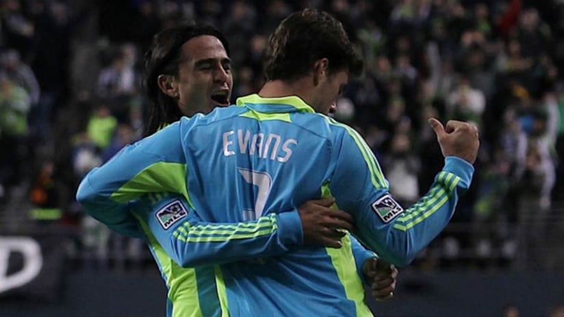 Mauro Rosales and Brad Evans celebrate after Evans' goal vs. Santos