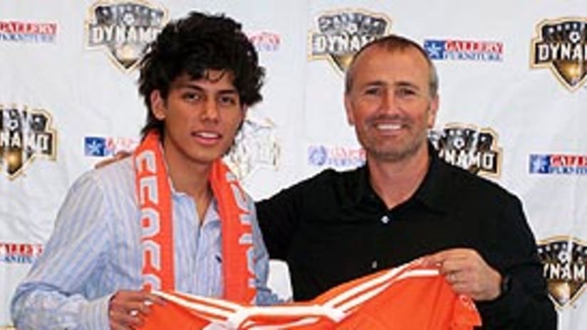 Josue Soto with Dynamo head coach Dominic Kinnear at the Dynamo offices.