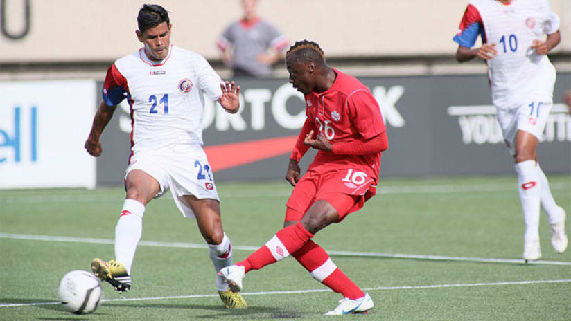 Randy Edwini-Bonsu takes a shot past Keilor Soto in the Canada vs. Costa Rica match